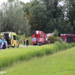 Man met scootmobiel te water bij Duifpolderkade