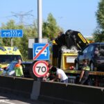 Toeristen wat later op het strand na ongeluk A20