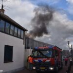 Schuttingbrand bij winkel de Hoofdstraat